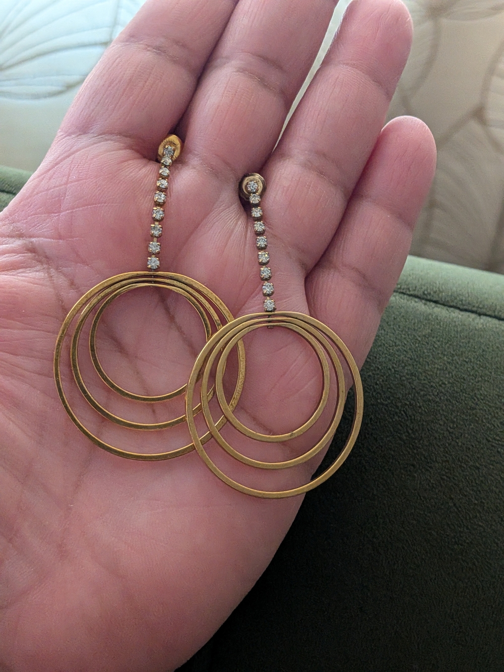 gold-tone triple hoop earrings feature a vertical drop studded w clear crystals